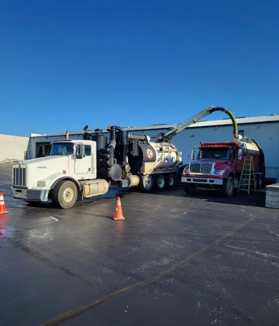 two trucks with a pump